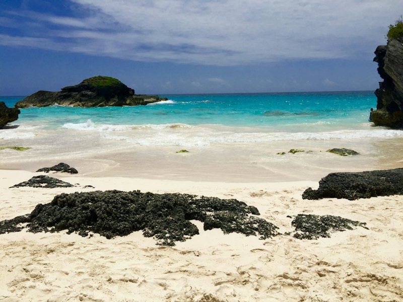 Turquoise water and dark rocks at Horseshoe Bay, Bermuda