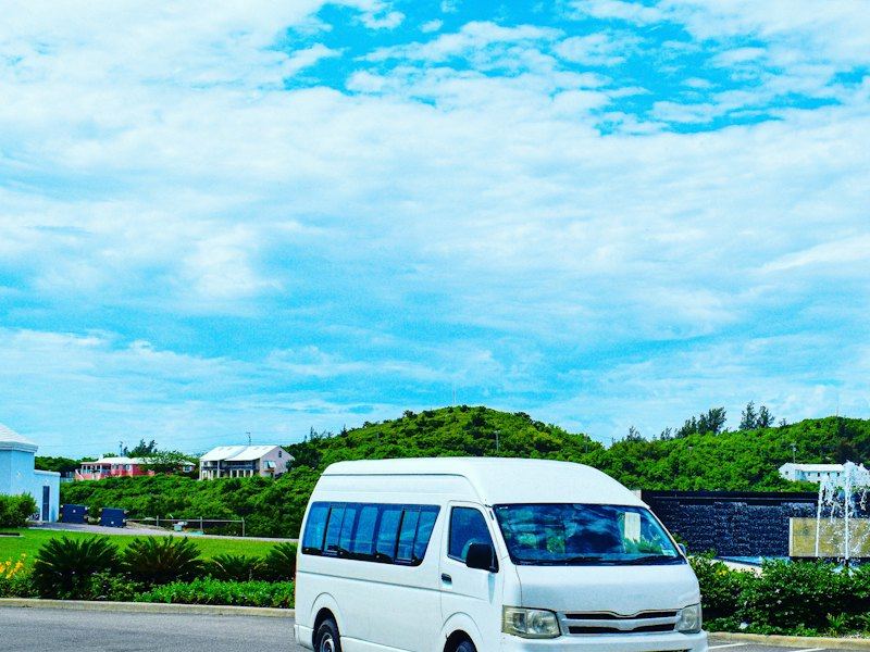 A white minivan on a road near the airport in St George's, Bermuda